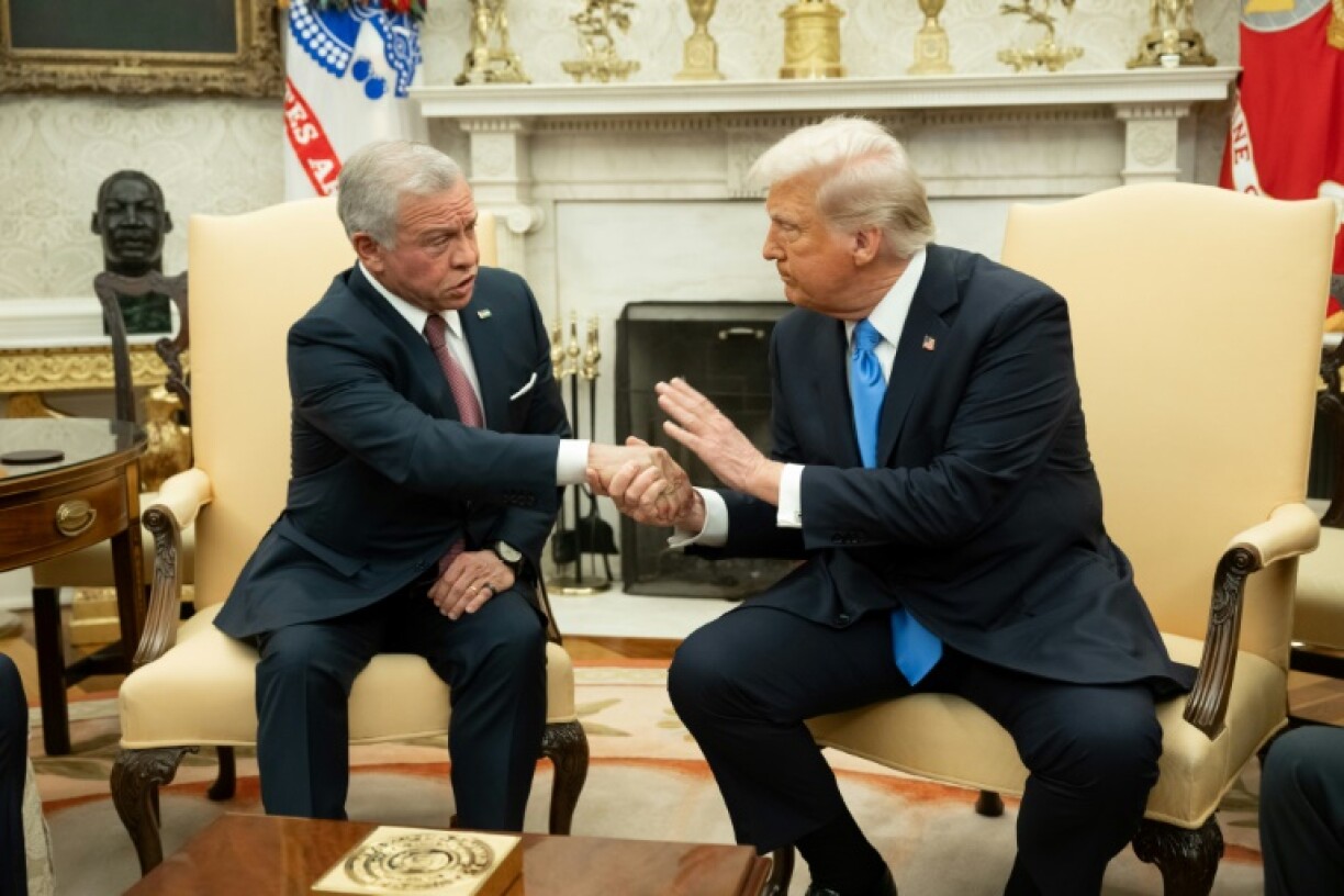 US President Donald Trump (R) shakes hands with King Abdullah II of Jordan during a meeting in the Oval Office of the White House in Washington, DC, on February 11, 2025.