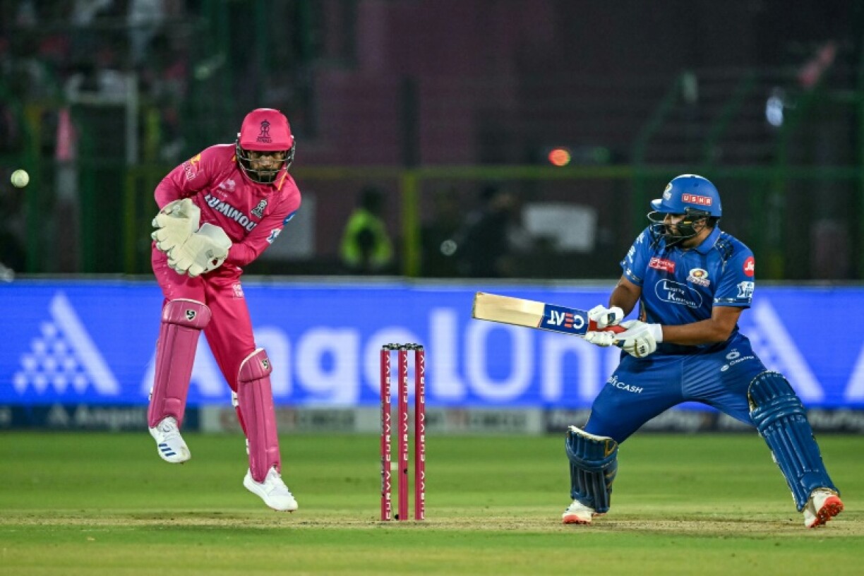 Mumbai Indians' Rohit Sharma (R) plays a shot during his side's comfortable IPL victory over Rajasthan Royals