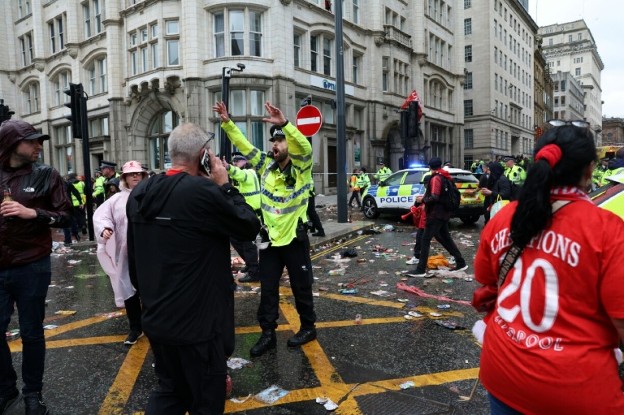 Liverpool's Premier League title celebrations were marred when a car rammed into a crowd of supporters