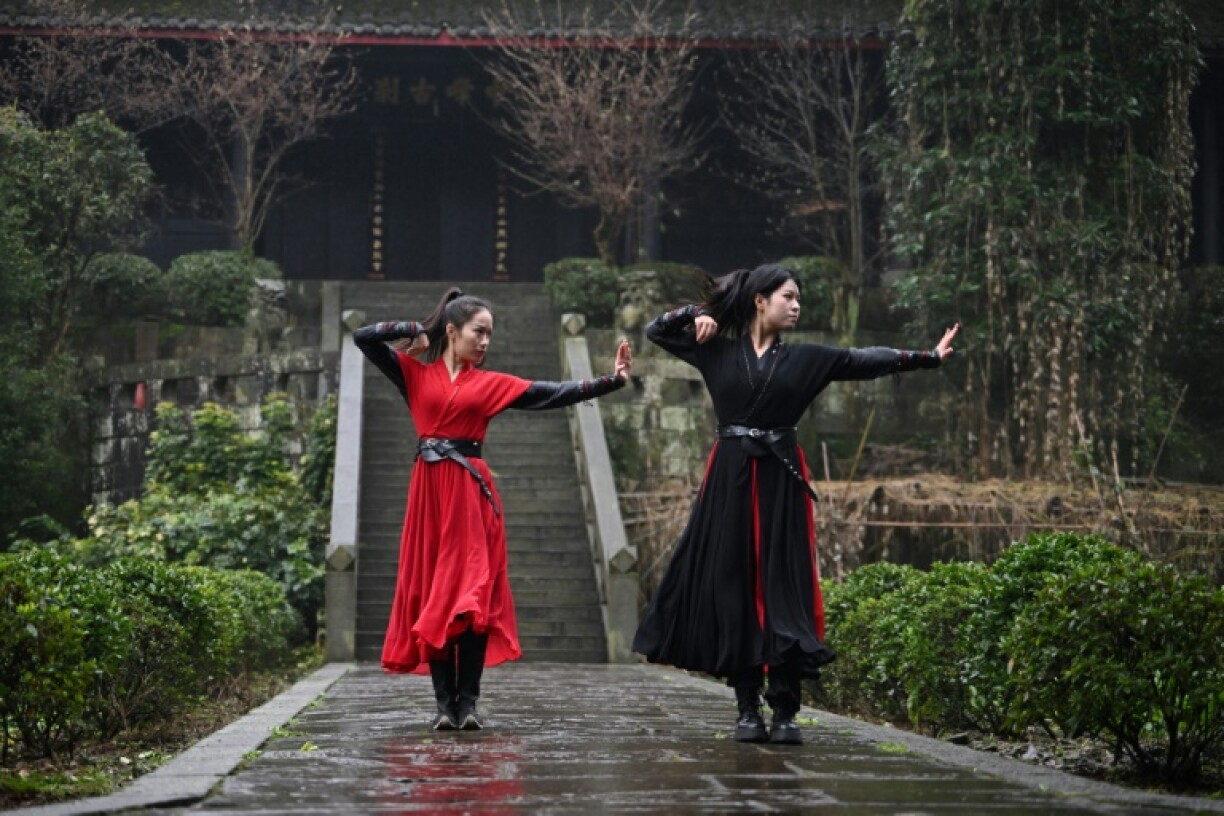 The all-woman Emei Kung Fu Girls troupe records slick videos of their skills, attracting renewed public interest in their ancient martial arts school