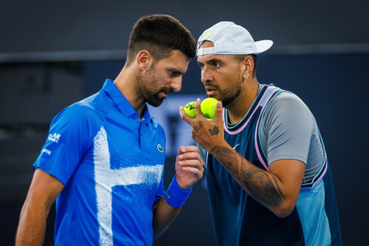 Nick Kyrgios (R) has pulled out an exhibiton match against Novak Djokovic (L) with an abdominal strain