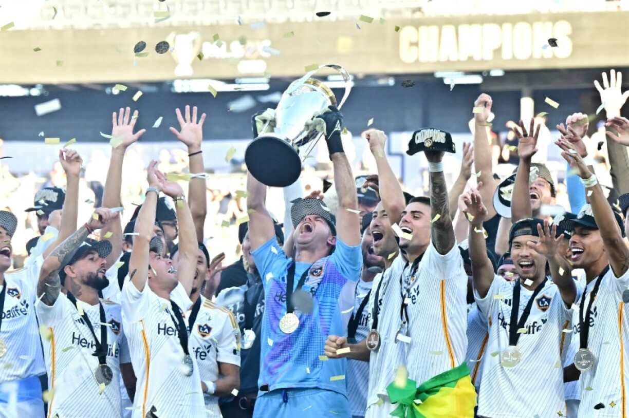 Los Angeles Galaxy players celebrate after winning the Major League Soccer (MLS) Cup Final for a record sixth time with a 2-1 win over the New York Red Bulls