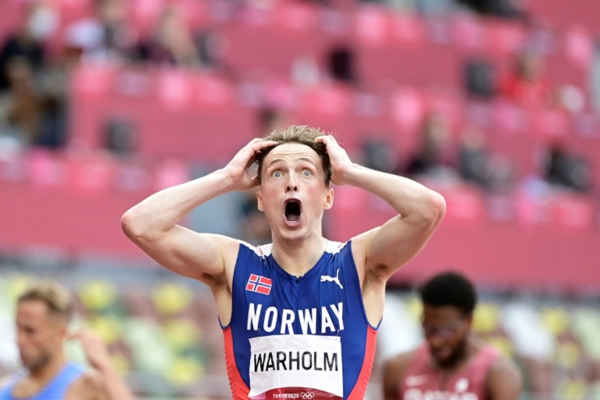 Norway's Karsten Warholm reacts after winning and breaking the world record in the men's 400m hurdles final during the Tokyo 2021 Olympic Games