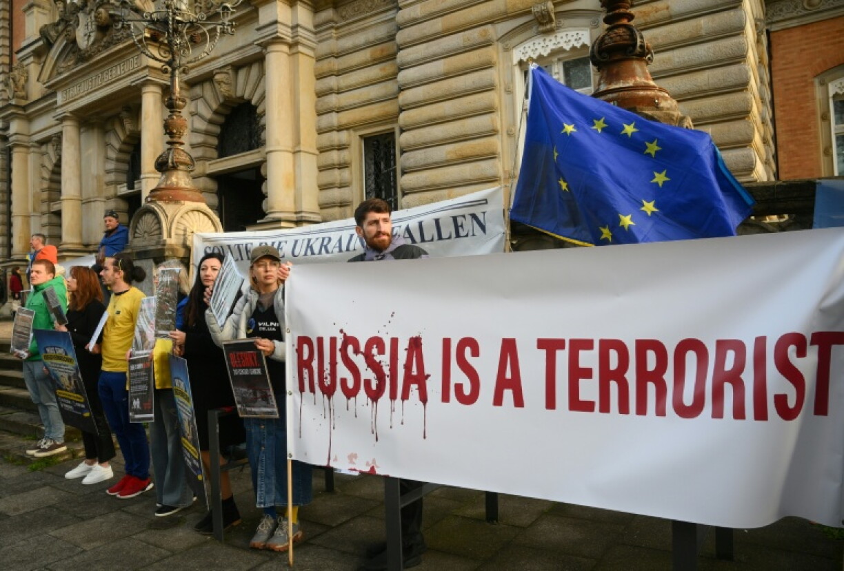 Protesters outside a Hamburg court before the opening of the first trial over the bombing of the Nord Stream pipelines
