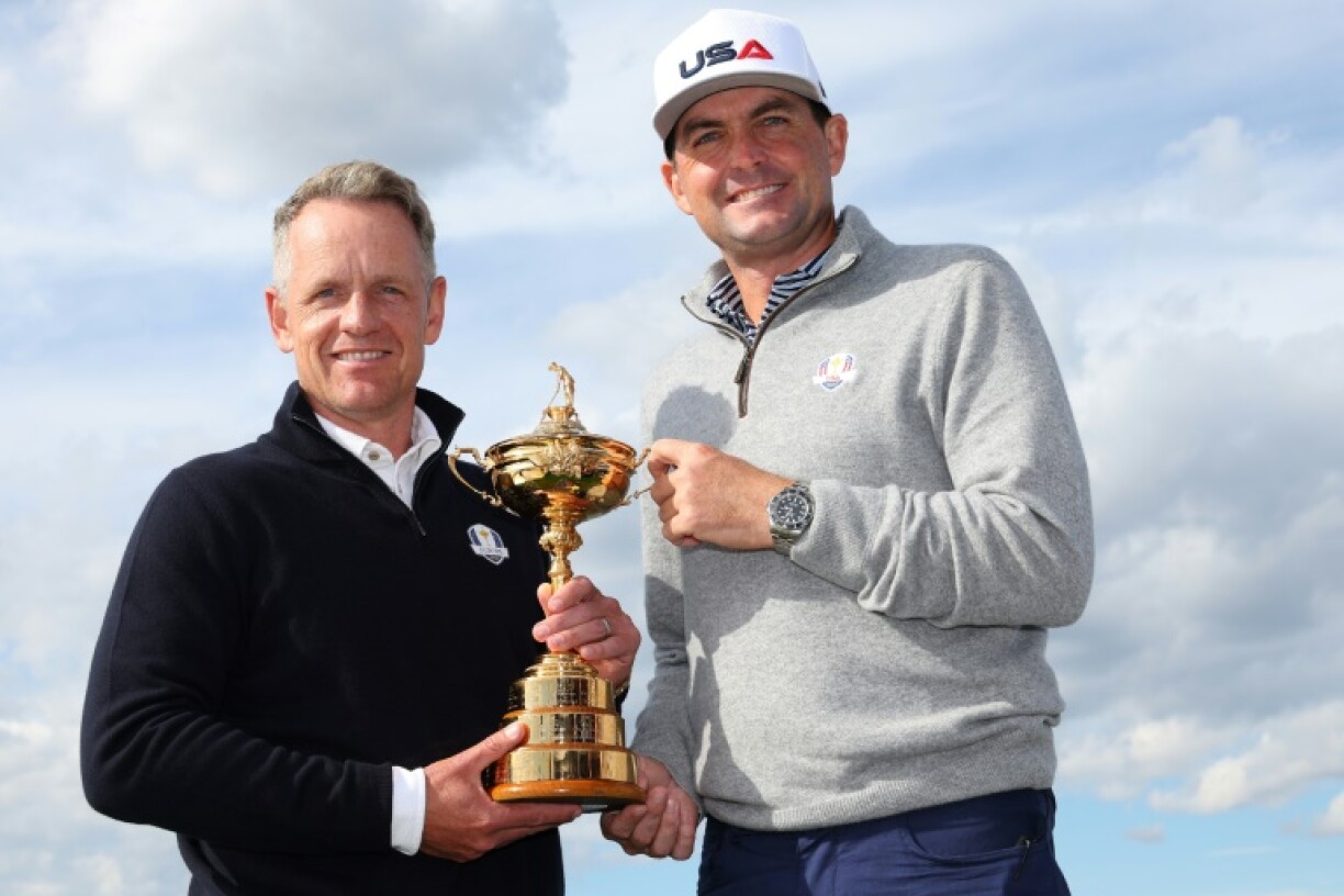 Europe captain Luke Donald, left, and United States captain Keegan Bradley, right, hold the Ryder Cup, which their golf teams will compete for at Bethpage Black