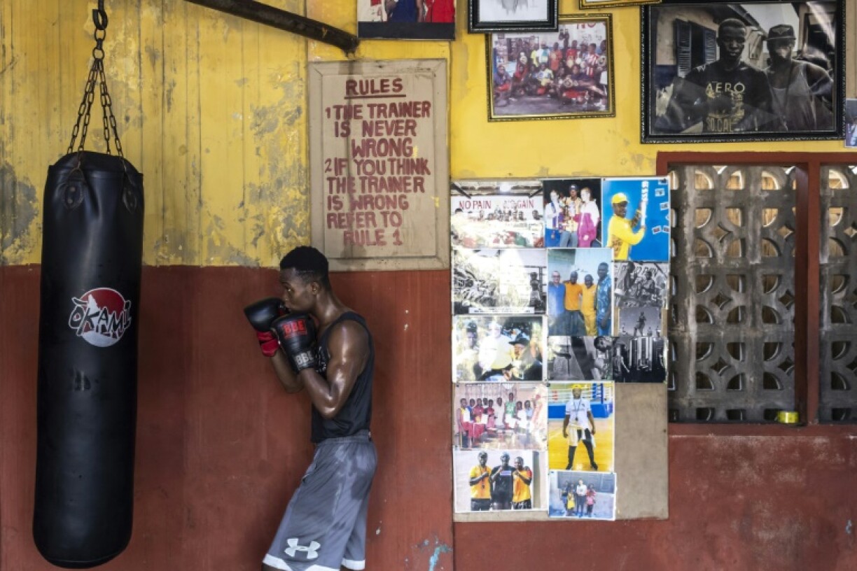 A boxer trains on the heavy bag at Ghana's Attoh Quarshie 'Home of the Sweet Science' gym