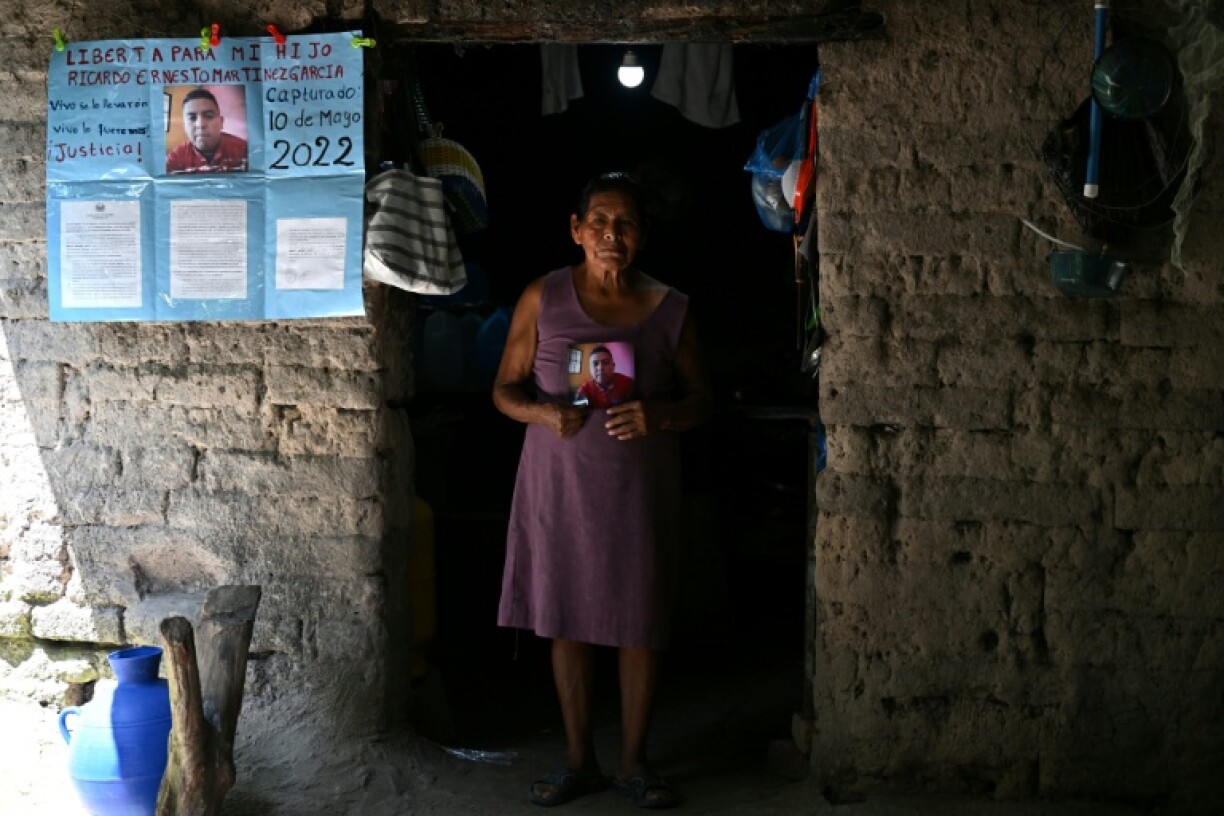 Ana Mercedes Garcia, 63, holds a picture of her son Ricardo Ernesto Martinez, 31, a construction worker imprisoned since May 10, 2022, under President Nayib Bukele's crackdown