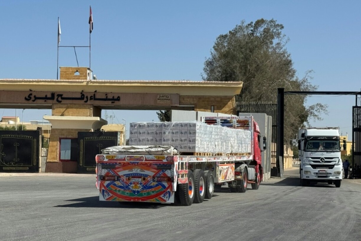 A truck loaded with humanitarian aid waits to cross from the Egyptian side of Rafah en rounte to the Kerem Shalom crossing into the Gaza Strip on October 20, 2025