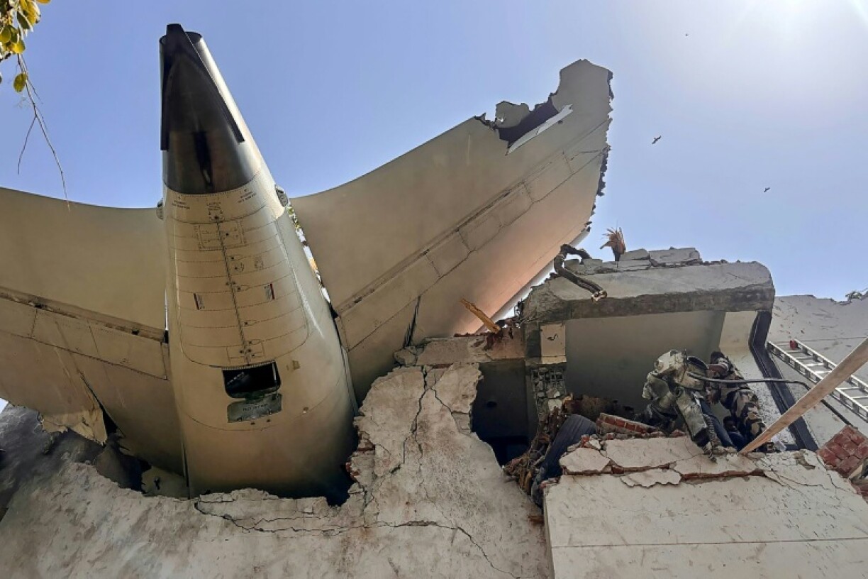 This handout photograph from the Central Industrial Security Force shows the back of an Air India passenger plane after the Boeing jet crashed in a residential area near the airport in Ahmedabad, India