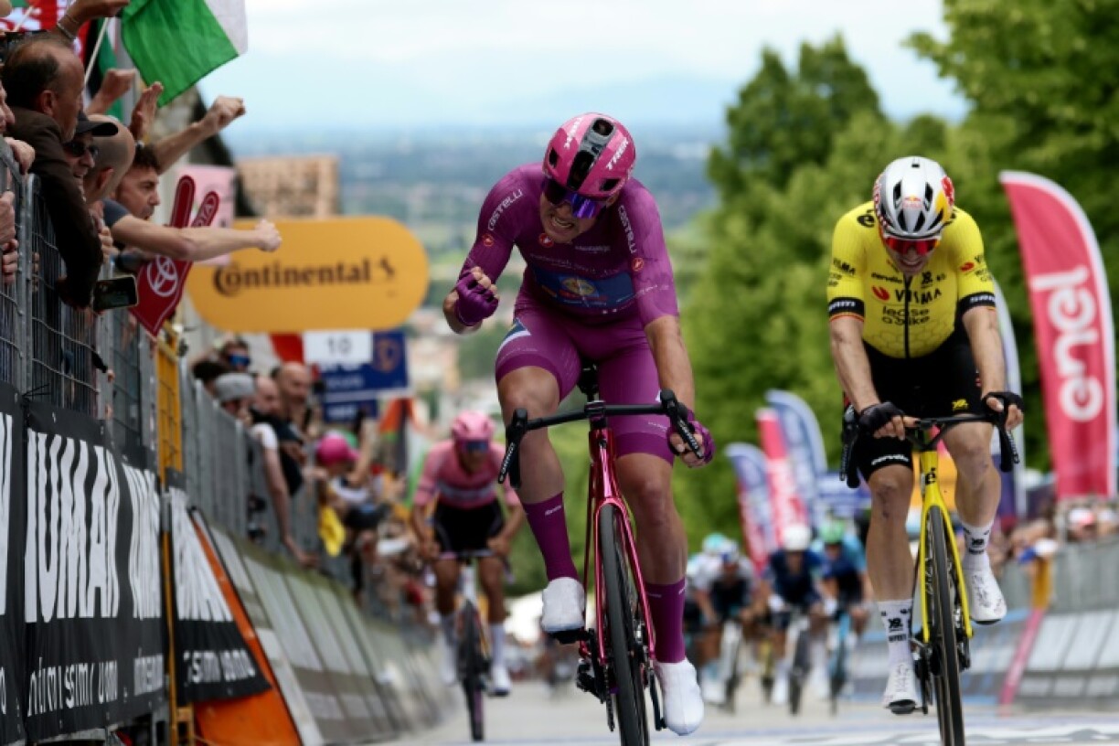 Mads Pedersen (L) celebrates winning the 13th stage of the Giro d'Italia.
