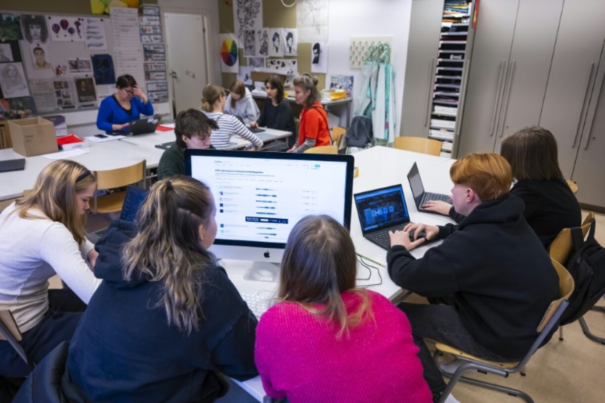 Students attend a class on media literacy at the Hiidenkiven Koulu school in Helsinki