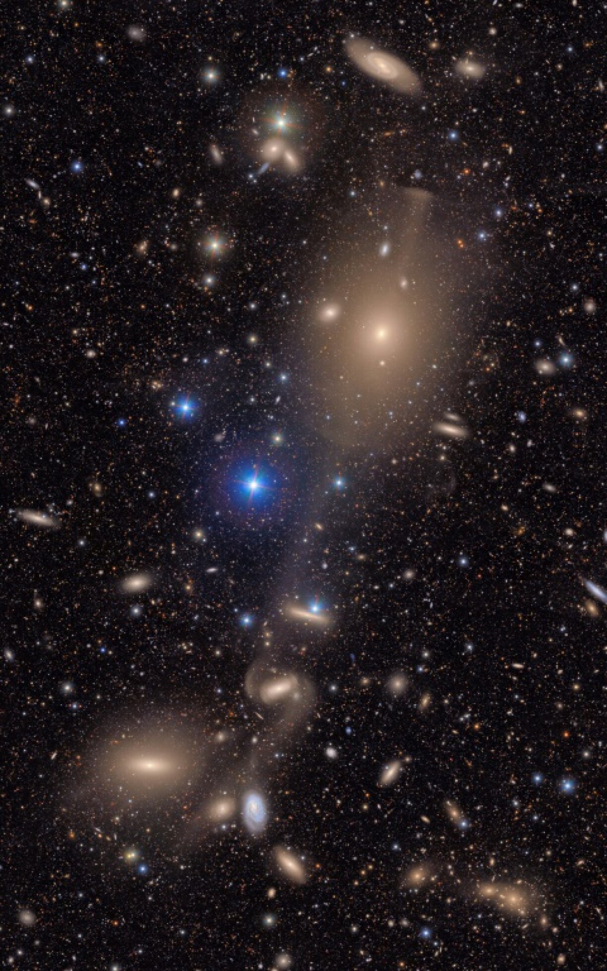 In just a small section of the Rubin Observatory's total view of the Virgo Cluster, bright stars shine in the foreground in front of many distant galaxies