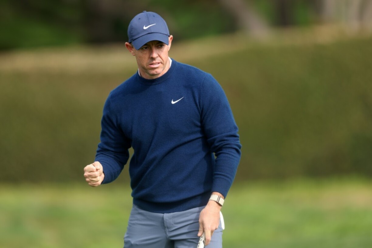 Third-ranked Rory McIlroy of Northern Ireland celebrates sinking an eagle putt at the 14th hole in the final round on his way to victory at the PGA Pebble Beach Pro-Am