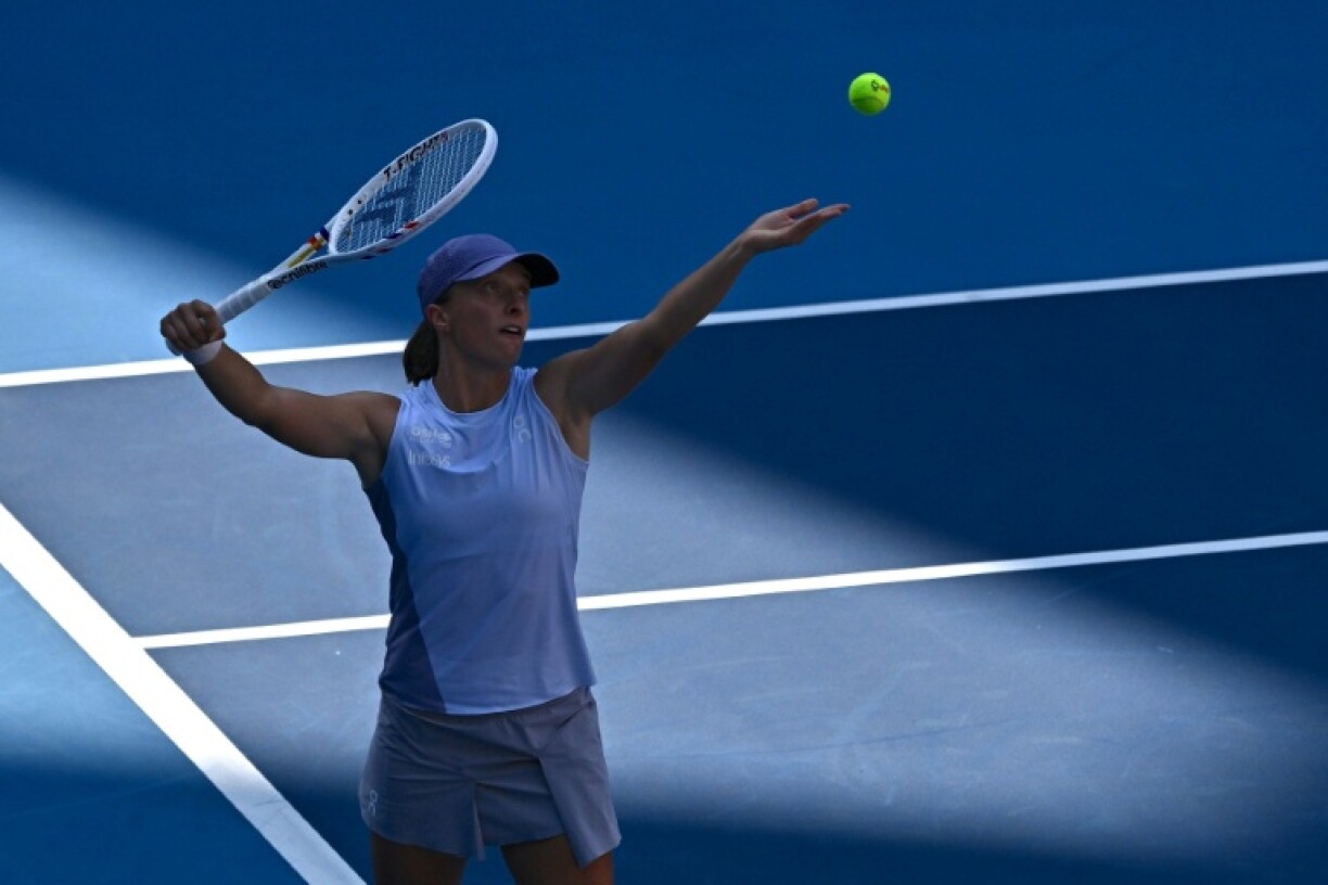 Poland’s Iga Swiatek serves to Colombia’s Camila Osorio in Beijing