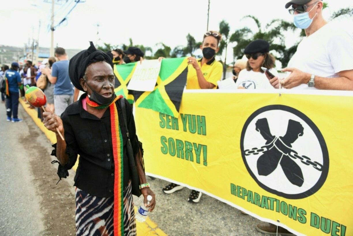 Protesters called for reparations for slavery outside the British High Commission as the Duke and Duchess of Cambridge arrived in Jamaica on Tuesday