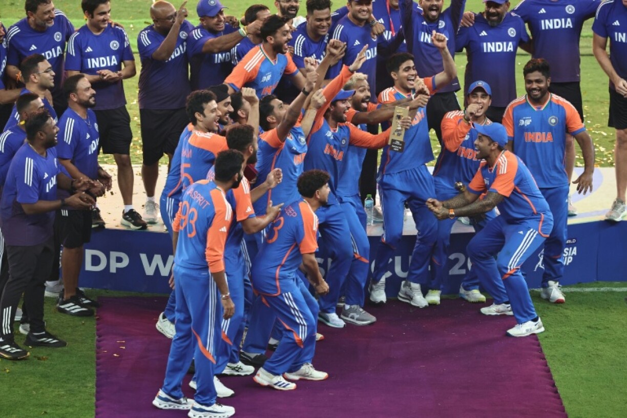 Indian captain Suryakumar Yadav (R) has been punished for bringing the game into disrepute, including his refusal to accept the Asia Cup trophy from a Pakistan official