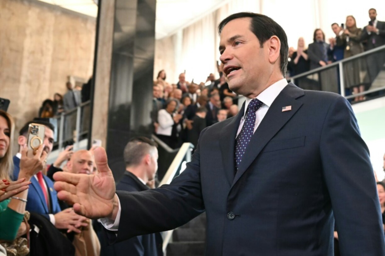 US Secretary of State Marco Rubio greets employees upon arrival at the State Department on January 21, 2025