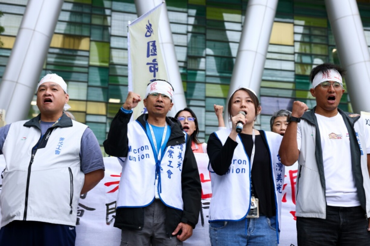 Striking Micron workers gathered outside the Taoyuan plant, near Taipei, as the company held a conference call with hundreds of other employees at the facility