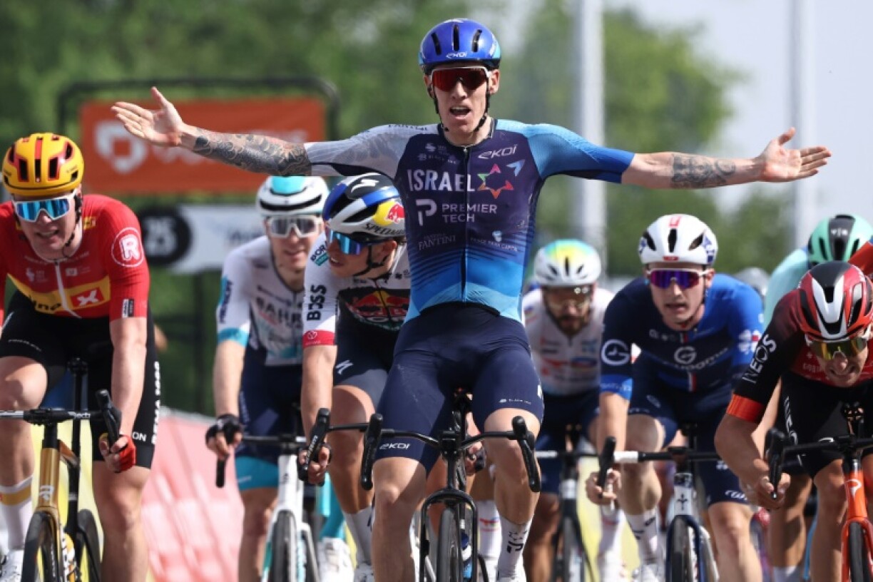 British rider Thomas Jake Stewart (C) celebrates his first World Tour win in the fifth stage of the Criterium du Dauphine
