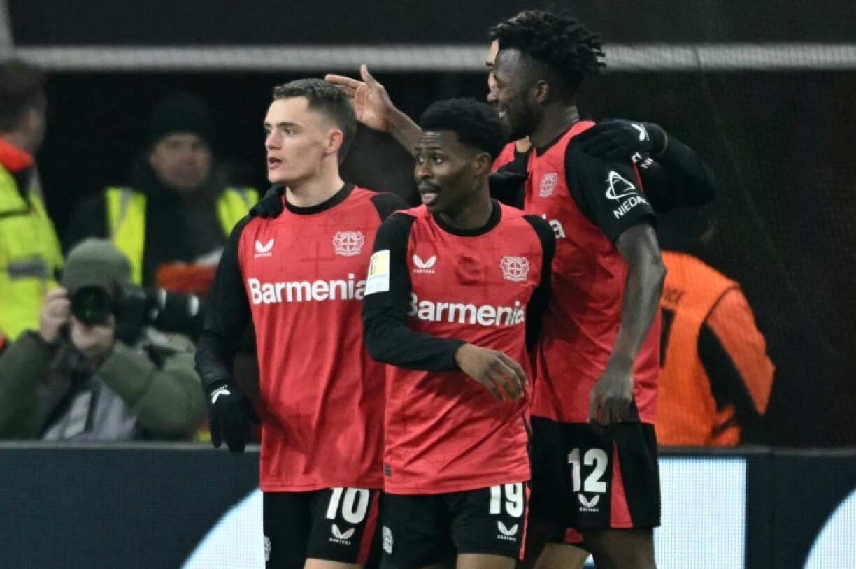 Bayer Leverkusen midfielder Florian Wirtz (L) scored two goals and laid on another against Borussia Moenchengladbach
