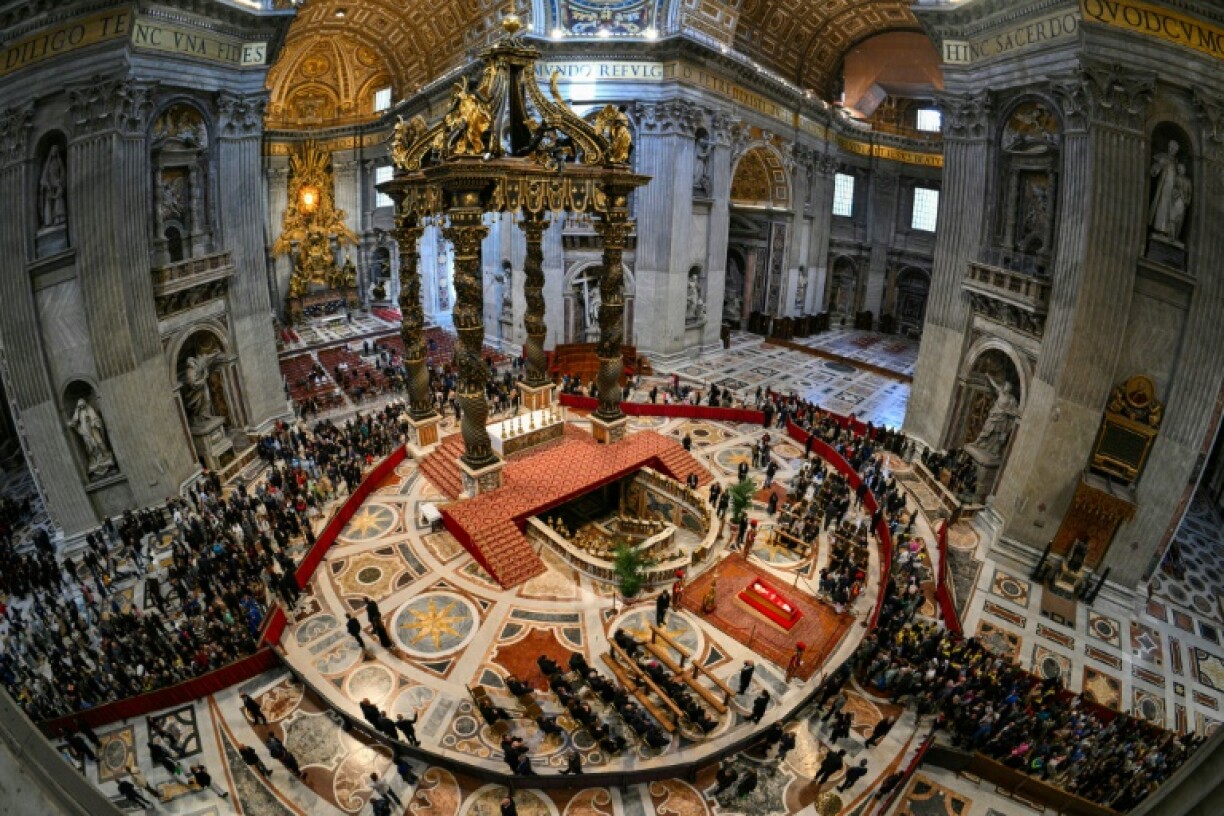 Each mourner was ushered past the casket within seconds