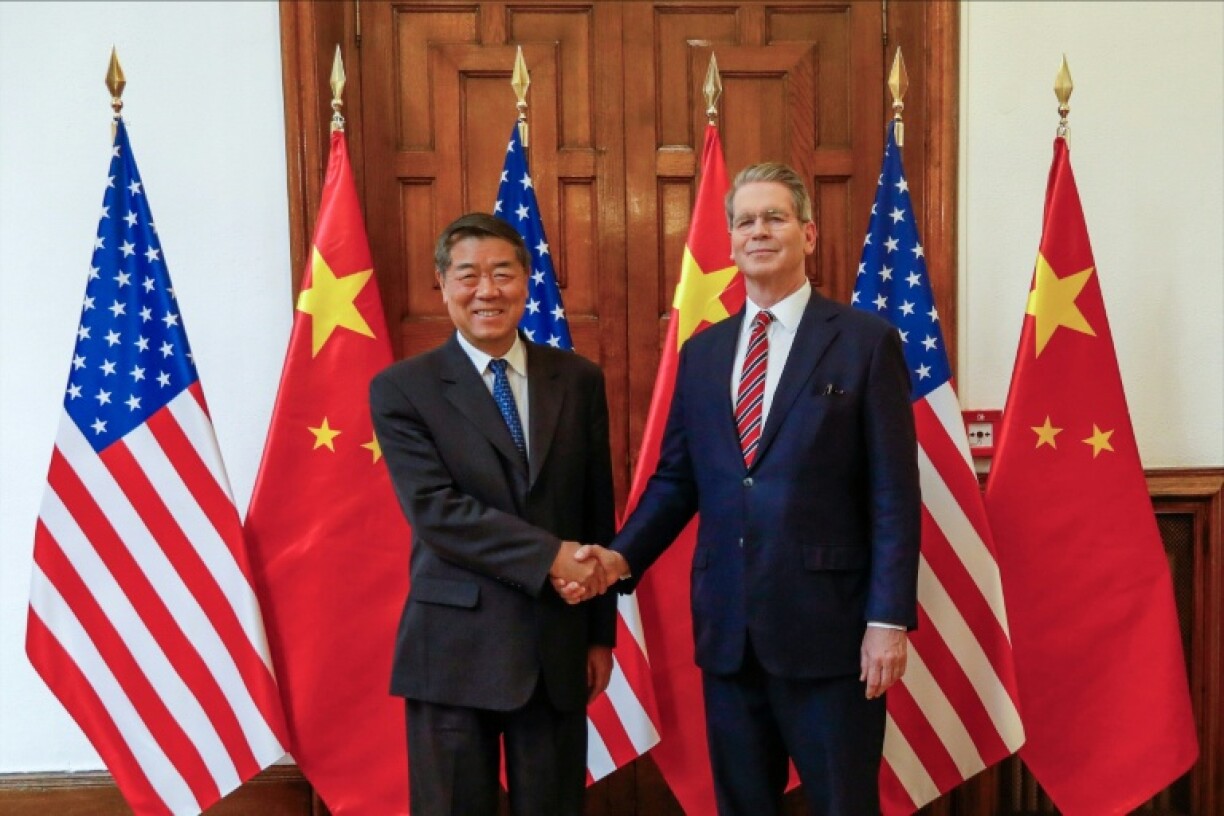 Chinese Vice Premiere He Lifeng (L) and US Treasury Secretary Scott Bessent and at their last meeting, in Madrid on September 14