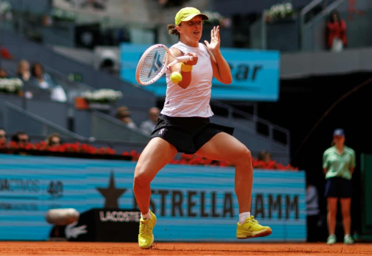 Iga Swiatek returns the ball during her Madrid Open quarter-final defeat of Madison Keys