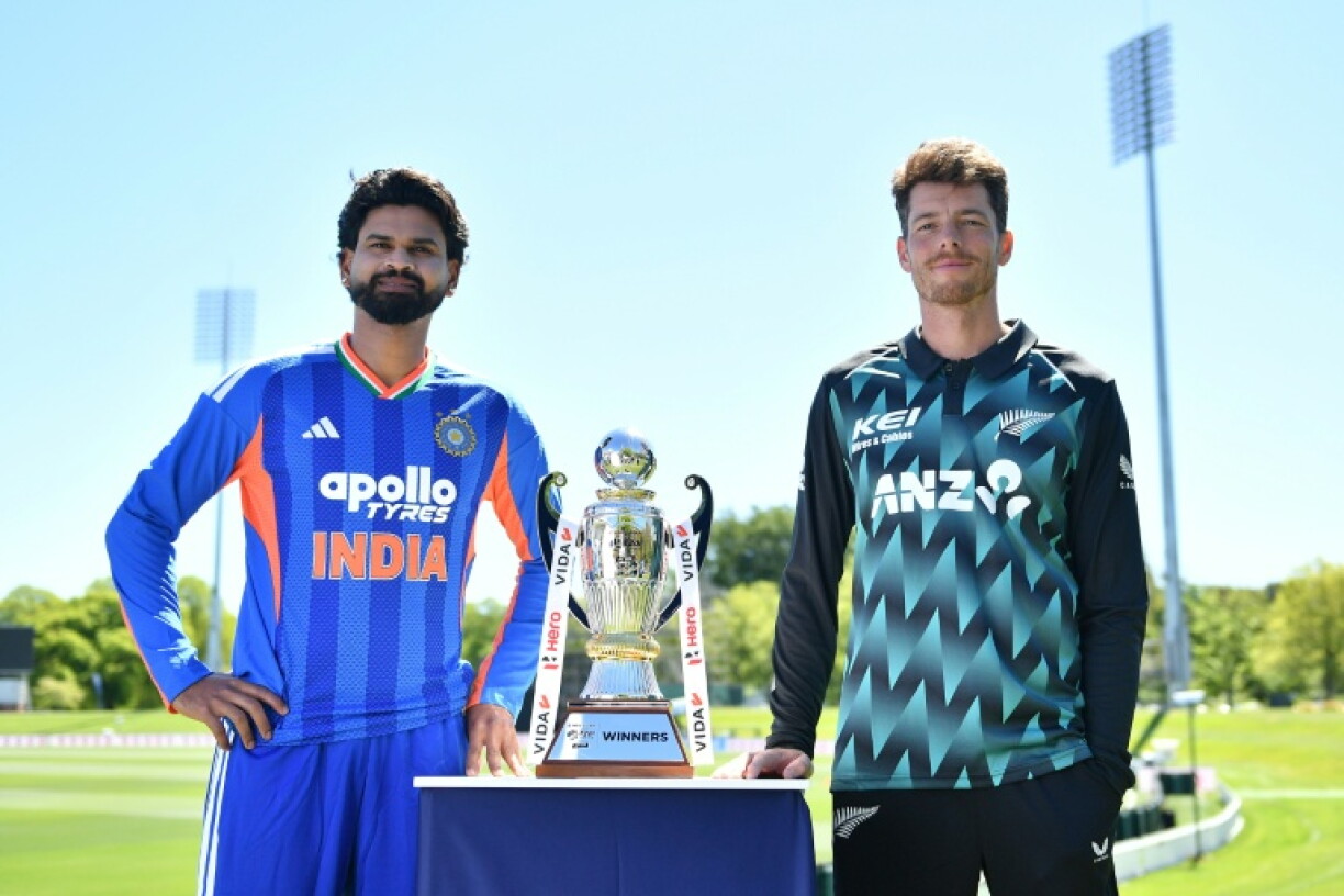 Captains New Zealand's Mitchell Santner (R) and India's Shreyas Iyer pose with the trophy ahead of the first Twenty20 international cricket match at Hagley Oval in Christchurch on October 21, 2026.