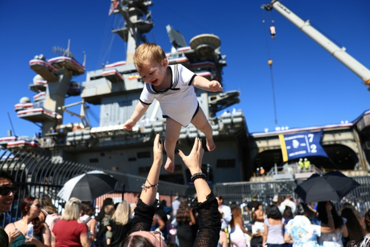 Families welcomed back service members aboard the USS Abraham Lincoln when it returned to its home port of San Diego after almost a year away
