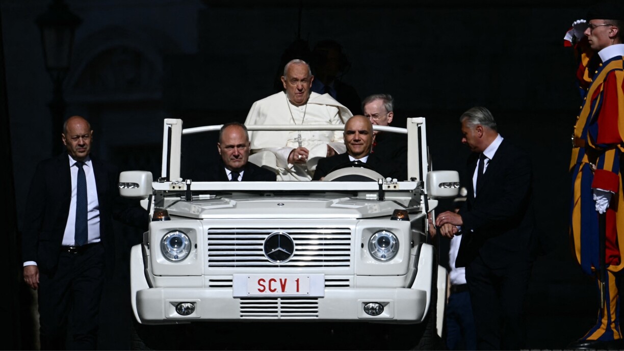 Pope Francis arrives on the popemobile for the weekly general audience at St Peter's square in The Vatican on 5 June 2024 .