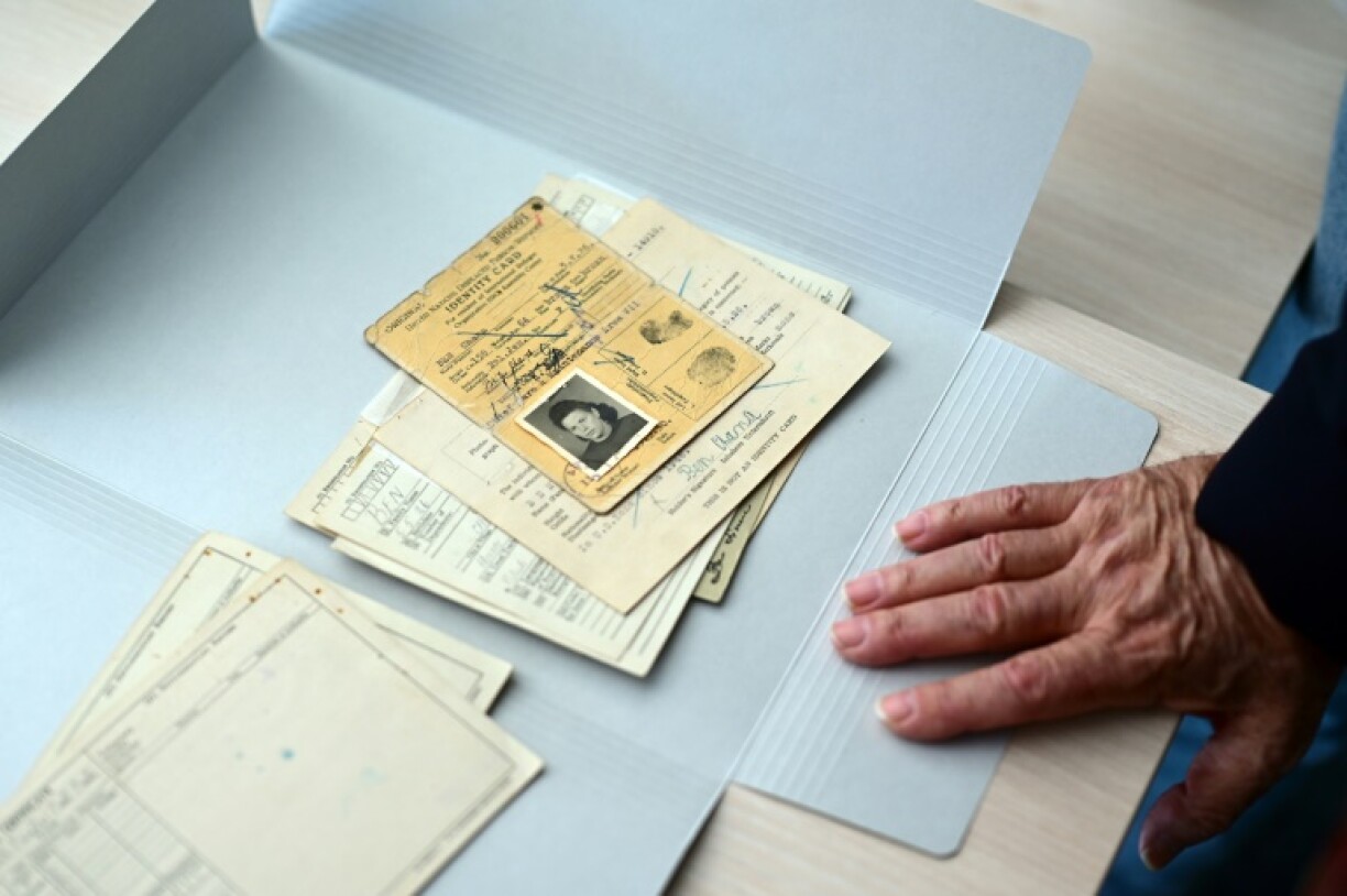 Ben reads his mother's documents in the Bad Arolsen archives