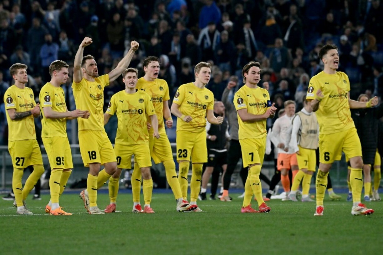 Bodo/Glimt players celebrate during their penalty shoot-out victory over Lazio in Rome in the Europa League quarter-finals