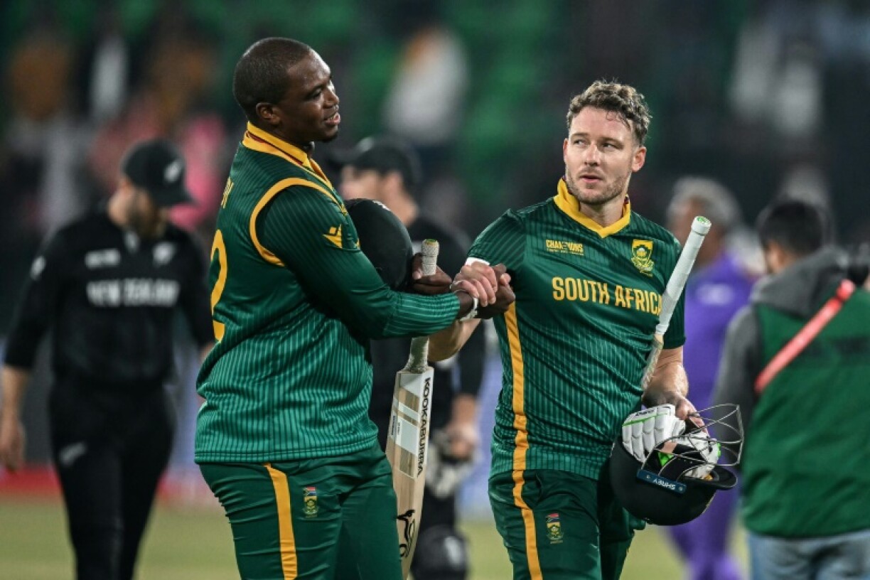 South Africa's David Miller (R) shakes hands with team-mate Lungi Ngidi after their side's defeat in the ICC Champions Trophy ODI semi-final against New Zealand