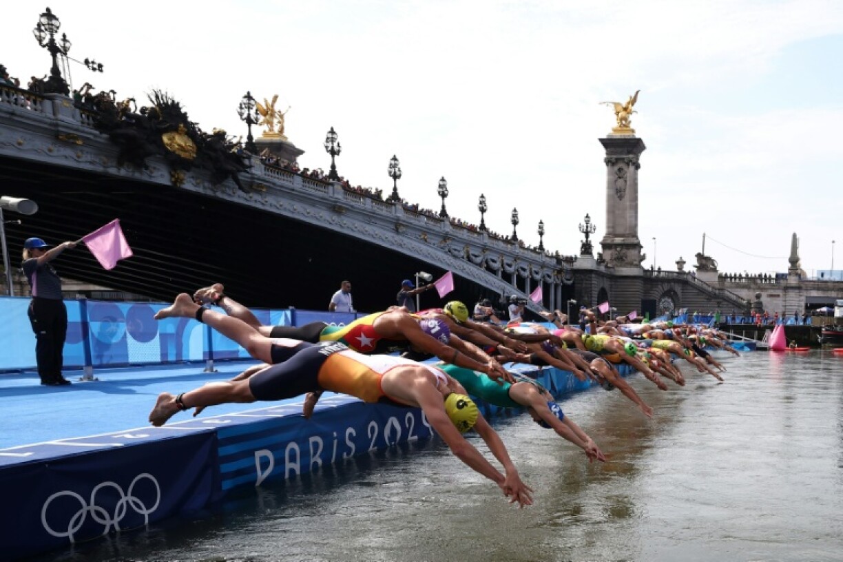 Athletes dive into the Seine during the Paris 2024 Olympic Games