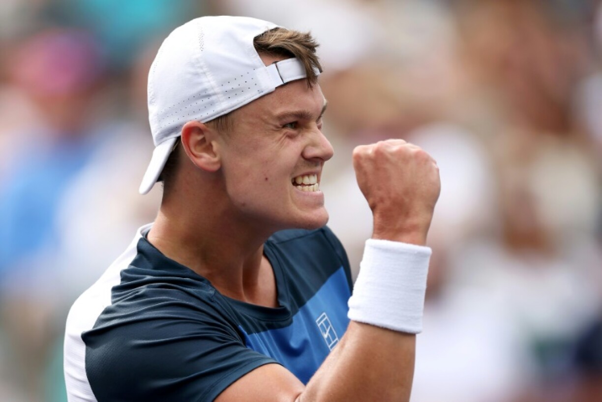 Denmark's Holger Rune celebrates his upset win over Stefanos Tsitsipas in the fourth round at Indian Wells