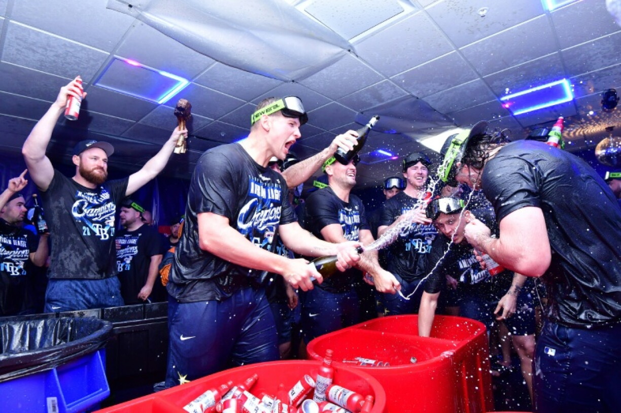 Tampa Bay Rays players celebrate reaching the World Series, where they will try to capture their first MLB crown when they face the Milwaukee Brewers