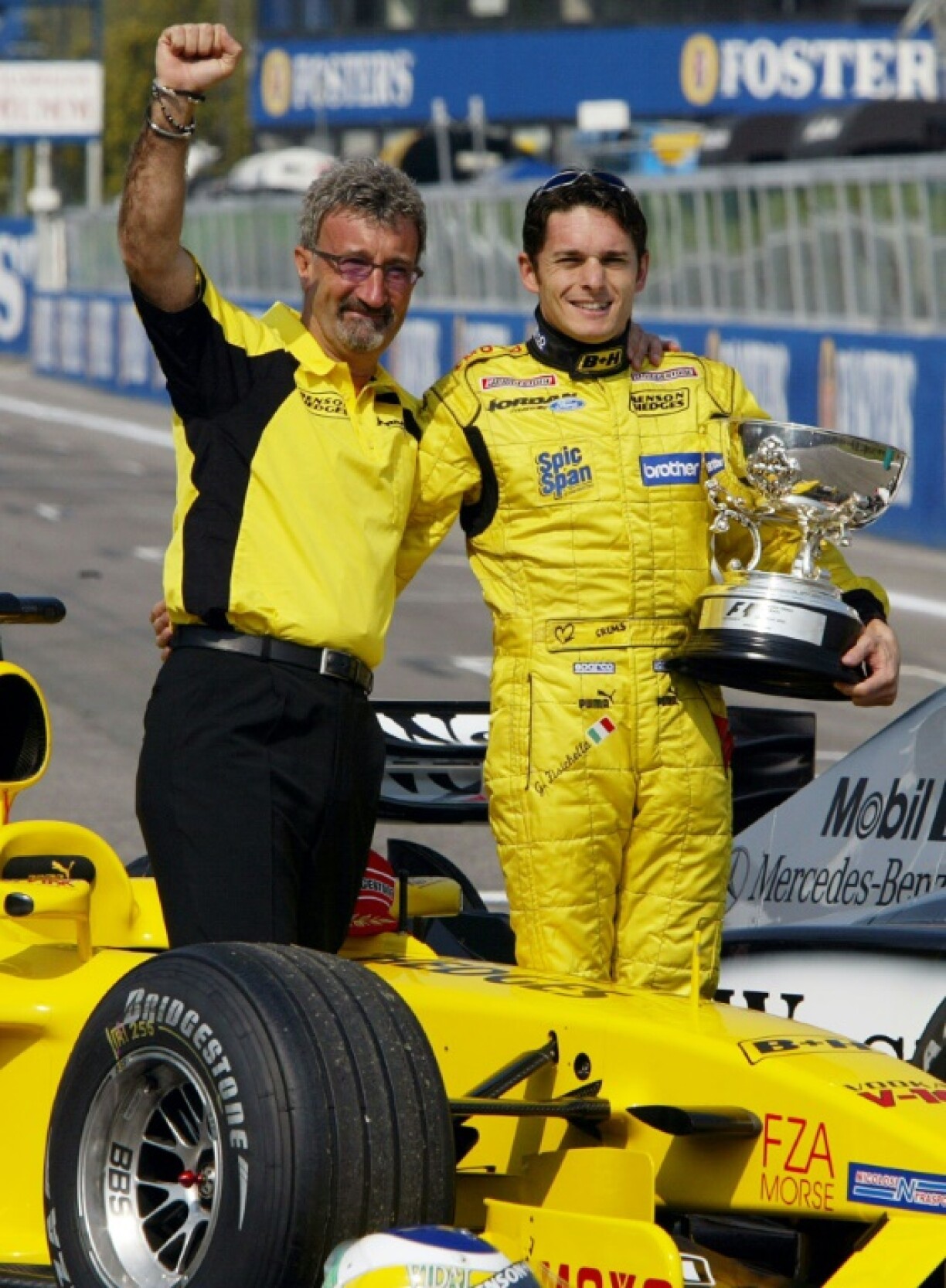 Jordan with Giancarlo Fisichella celebrating his team's last win in 2003