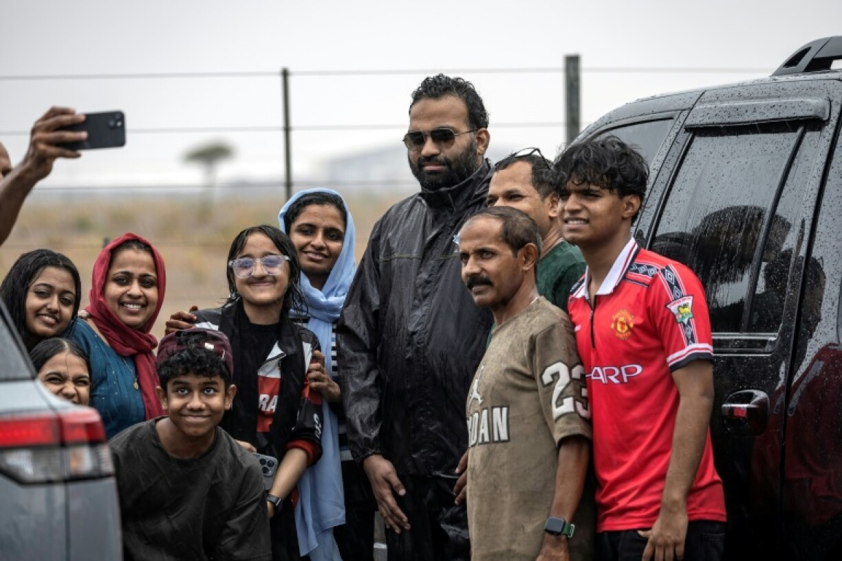 Happy rain chasers take selfies with