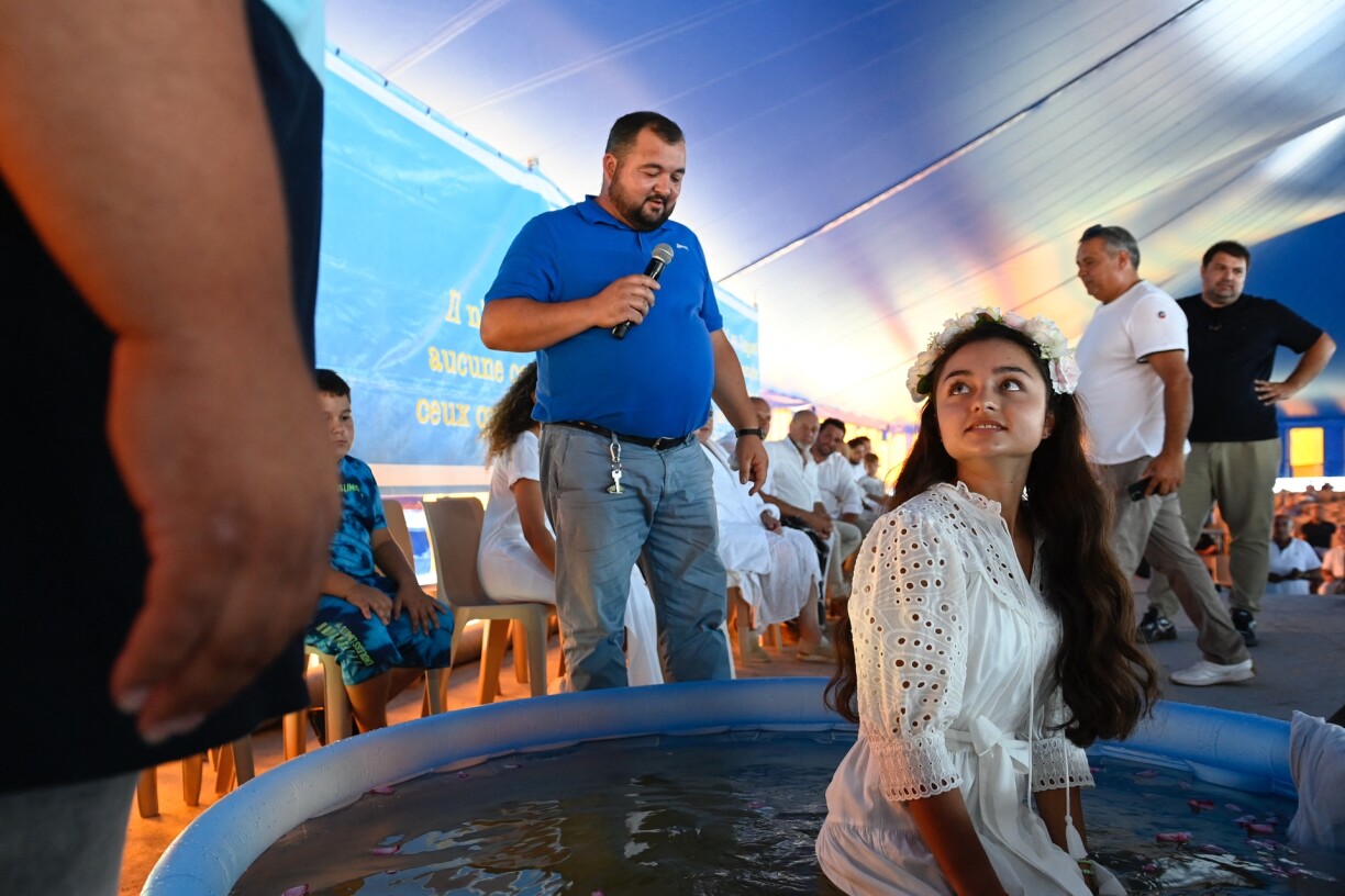 A young woman, ready to be baptised in an evangelical