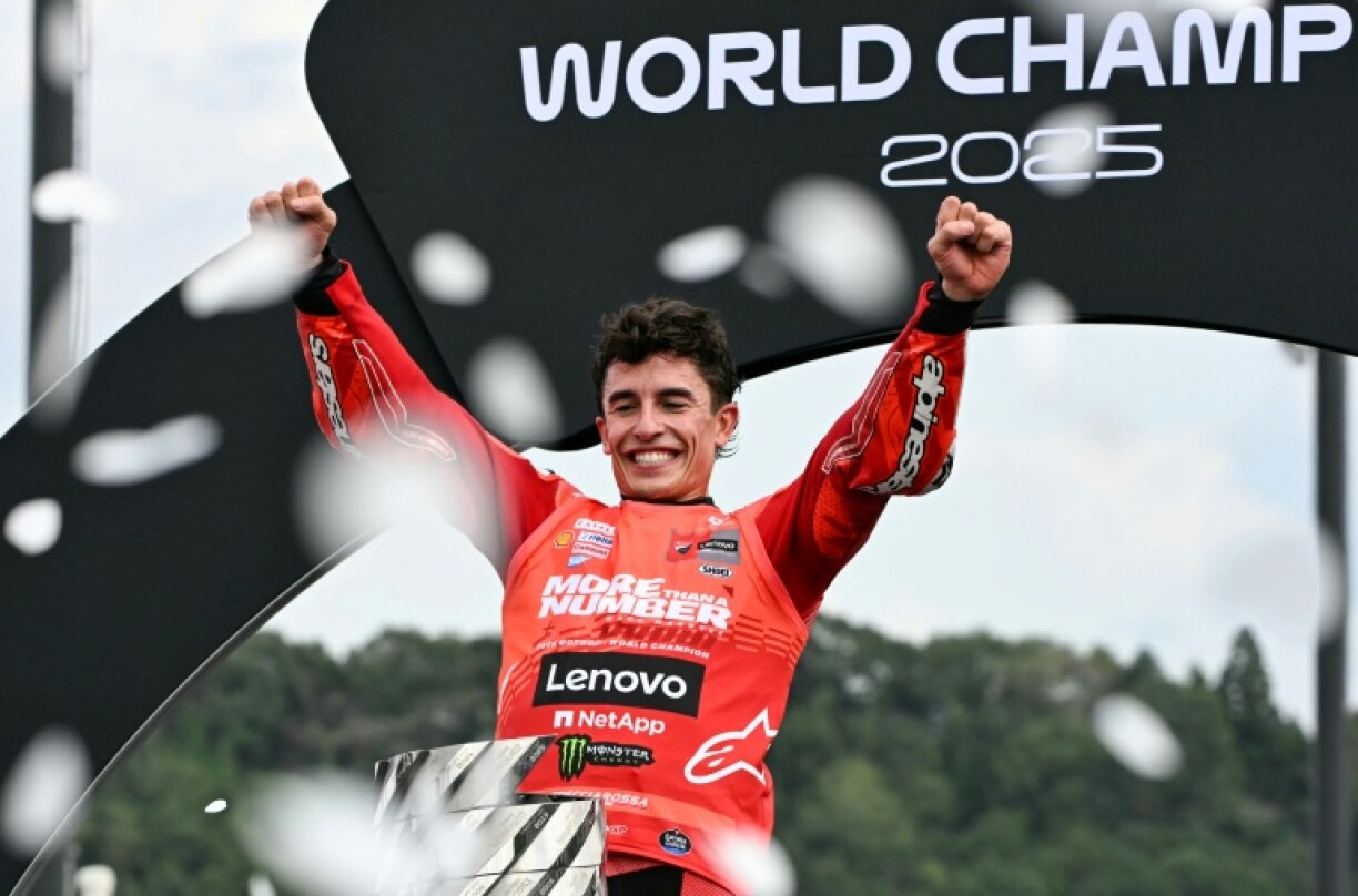 Marc Marquez celebrates wining his seventh MotoGP world championship in Japan