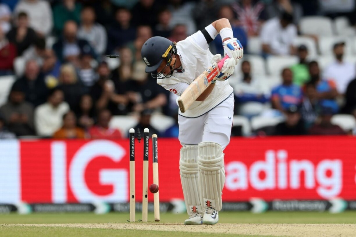 England's Ollie Pope is bowled by India's Prasidh Krishna