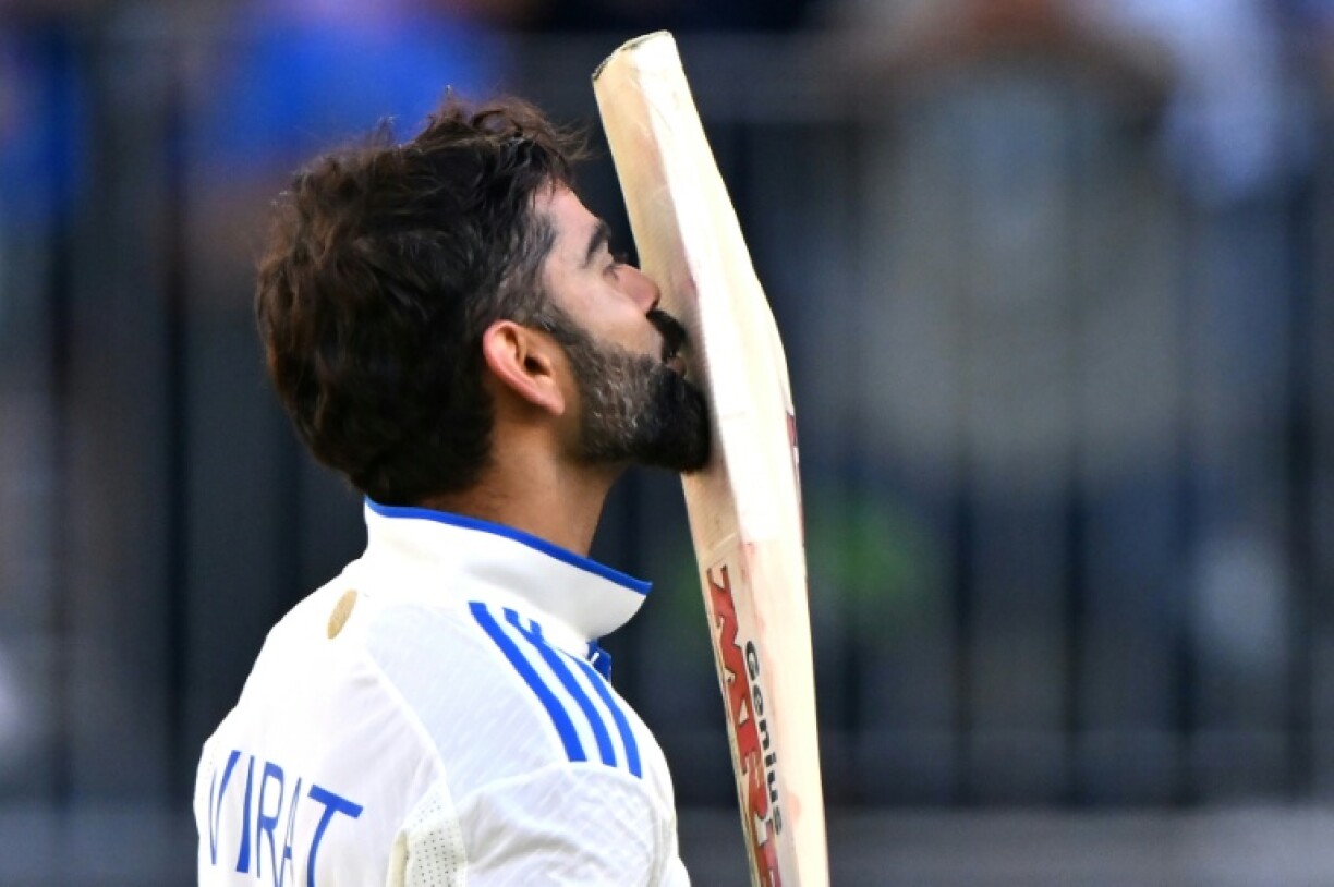 Virat Kohli celebrates reaching a century during the first Test against Australia in Perth in December 2024