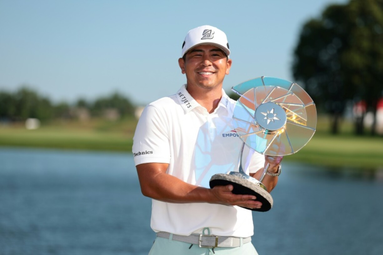 American Kurt Kitayama celebrates with the trophy after winning the 3M Open for his second US PGA Tour title