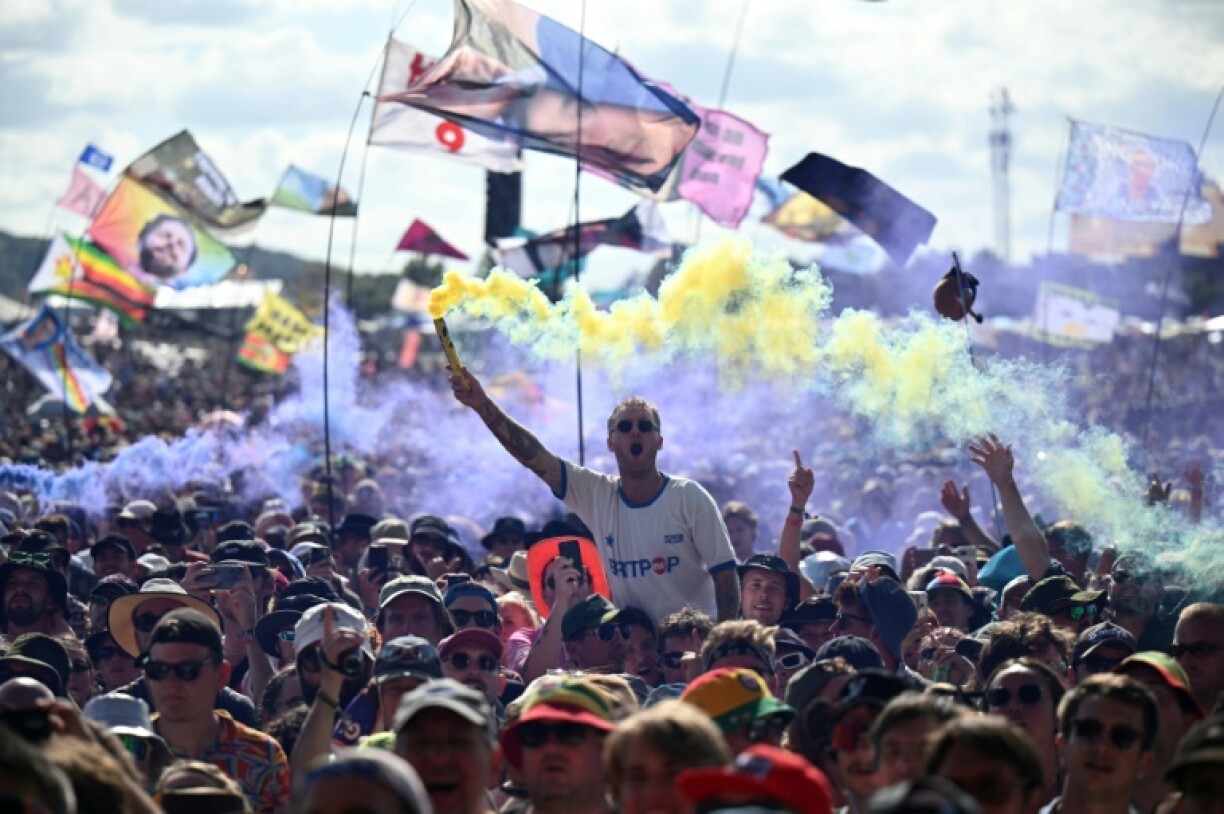 Festivalgoers watch Scottish rock band Franz Ferdinand