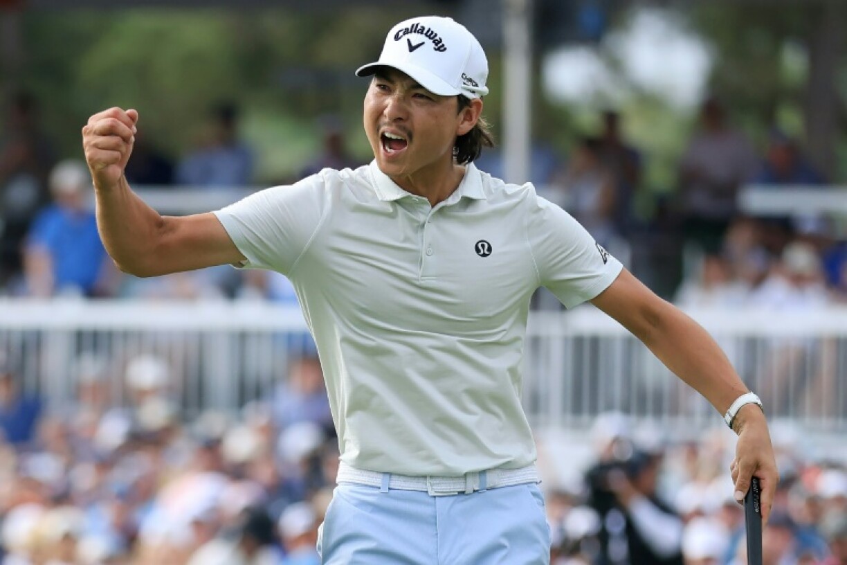 Australia's Min Woo Lee celebrates after tapping in a par putt on the 18th green at the Houston Open to clinch his first PGA Tour victory