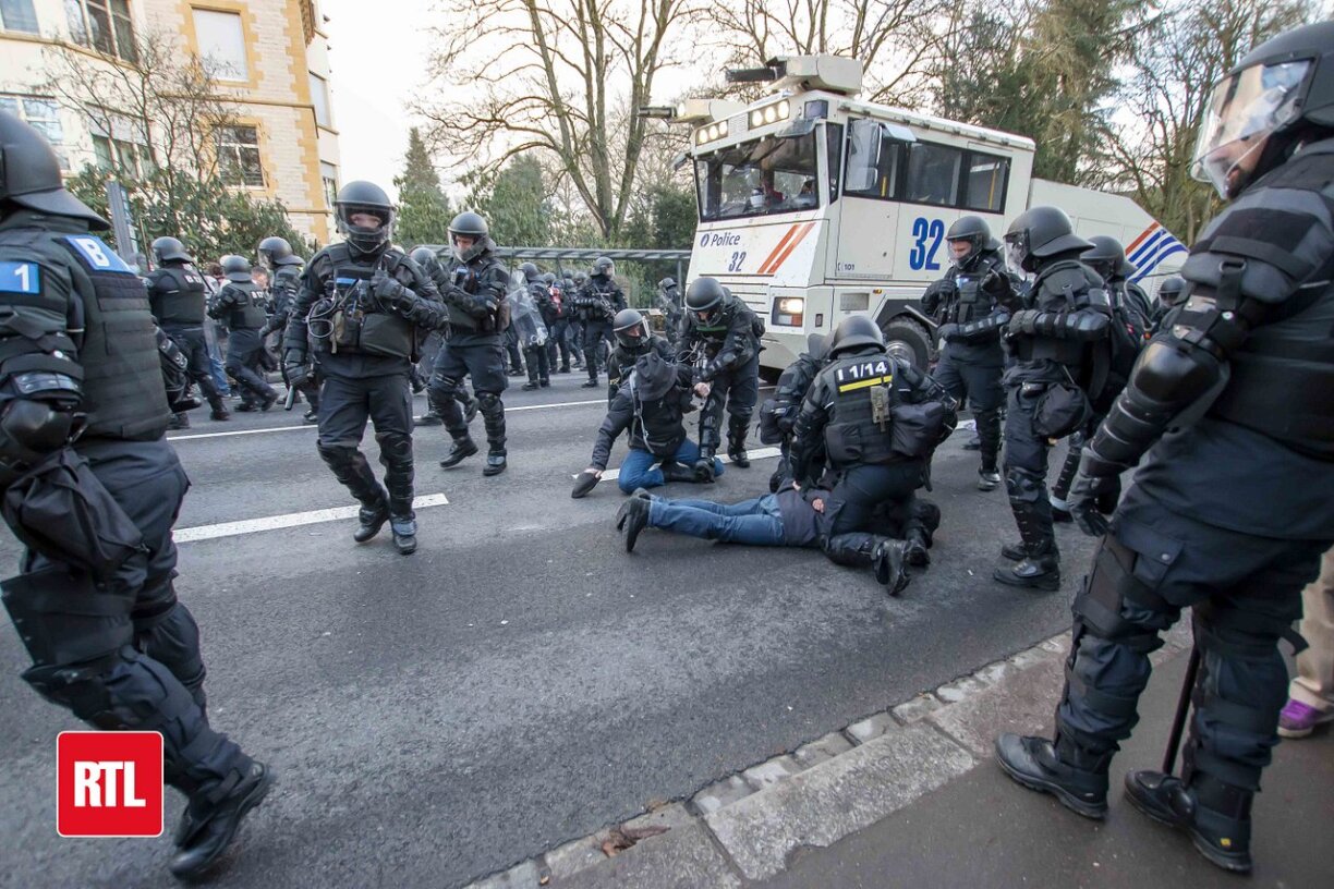 Protestors being arrested at an anti-coronavirus demonstration on 11 December, when water cannons were deployed.