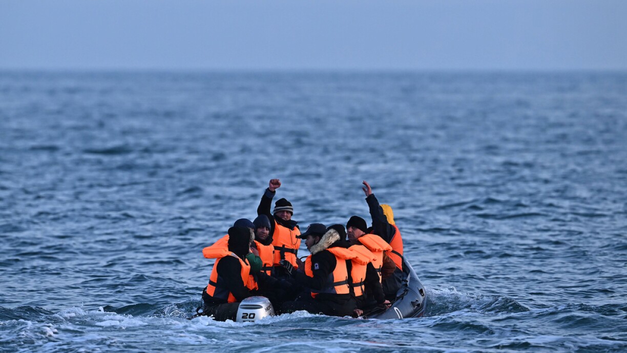 Migrants travel in an inflatable boat across the English Channel, bound for Dover on the south coast of England. More than 45,000 migrants arrived in the UK last year by crossing the English Channel on small boats.