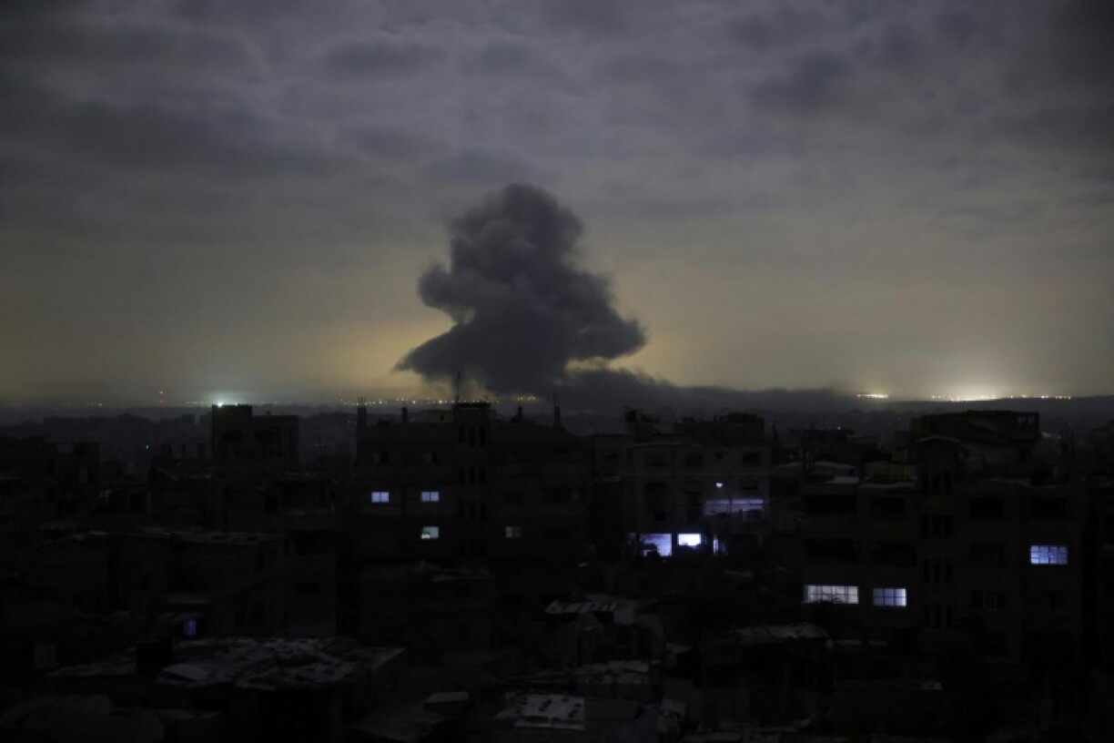 Smoke billows amid reported building detonations by Israeli forces to the east and north of Jabalia city in the northern Gaza Strip at dawn