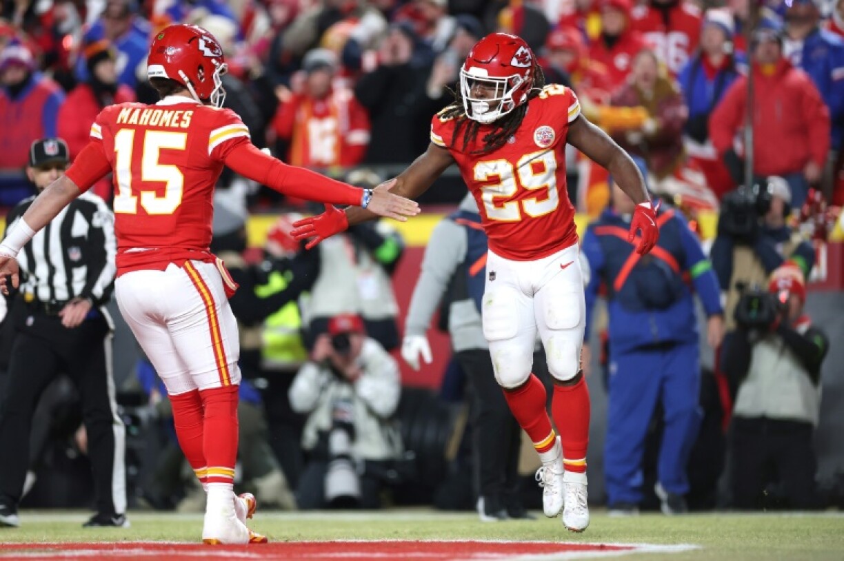 Kareem Hunt of the Kansas City Chiefs celebrates his touchdown run with quarterback Patrick Mahomes in the Chiefs' victory over the Buffalo Bills in the NFL's AFC Championship game