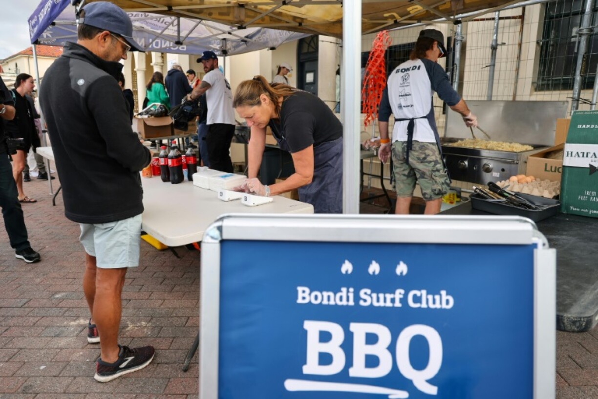 Voters are enticed by sizzling snags (sausages) on offer at more than 1,000 polling sites to support local causes